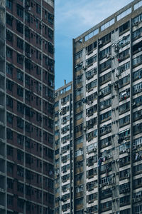 Low angle view of buildings in city against sky