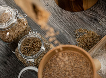 High angle view of coffee beans in jar on table