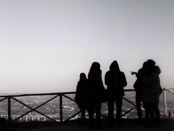 Silhouette of woman against clear sky