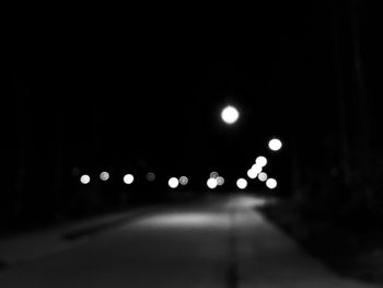 Illuminated street lights at night
