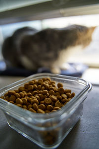 Close-up of coffee beans in glass bowl on table