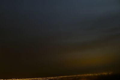 Scenic view of landscape against sky at night