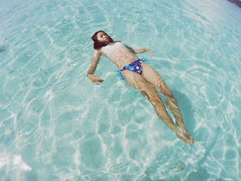 High angle view of woman swimming in pool