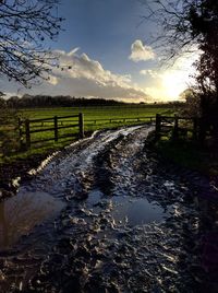 Scenic view of landscape against cloudy sky