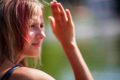 Close-up portrait of woman drinking water