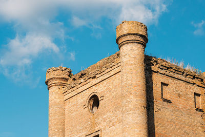 Low angle view of old building against sky