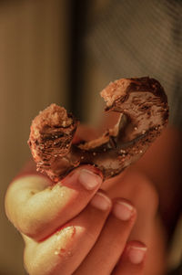 Close-up of hand holding ice cream