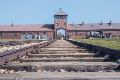 Surface level of railroad tracks against clear sky