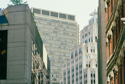 Low angle view of modern buildings against clear sky
