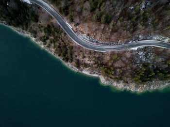 Aerial view of road by lake