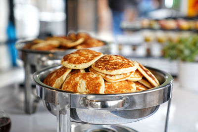 Close-up of waffles and chocolate food on table buffet