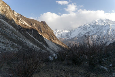 Scenic view of snowcapped mountains against sky