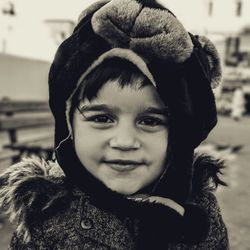 Close-up portrait of cute girl wearing bear suit