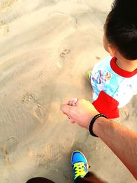 Close-up of man with multi colored sand