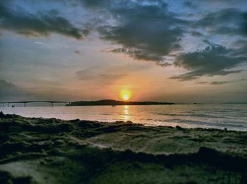 Scenic view of sea at sunset