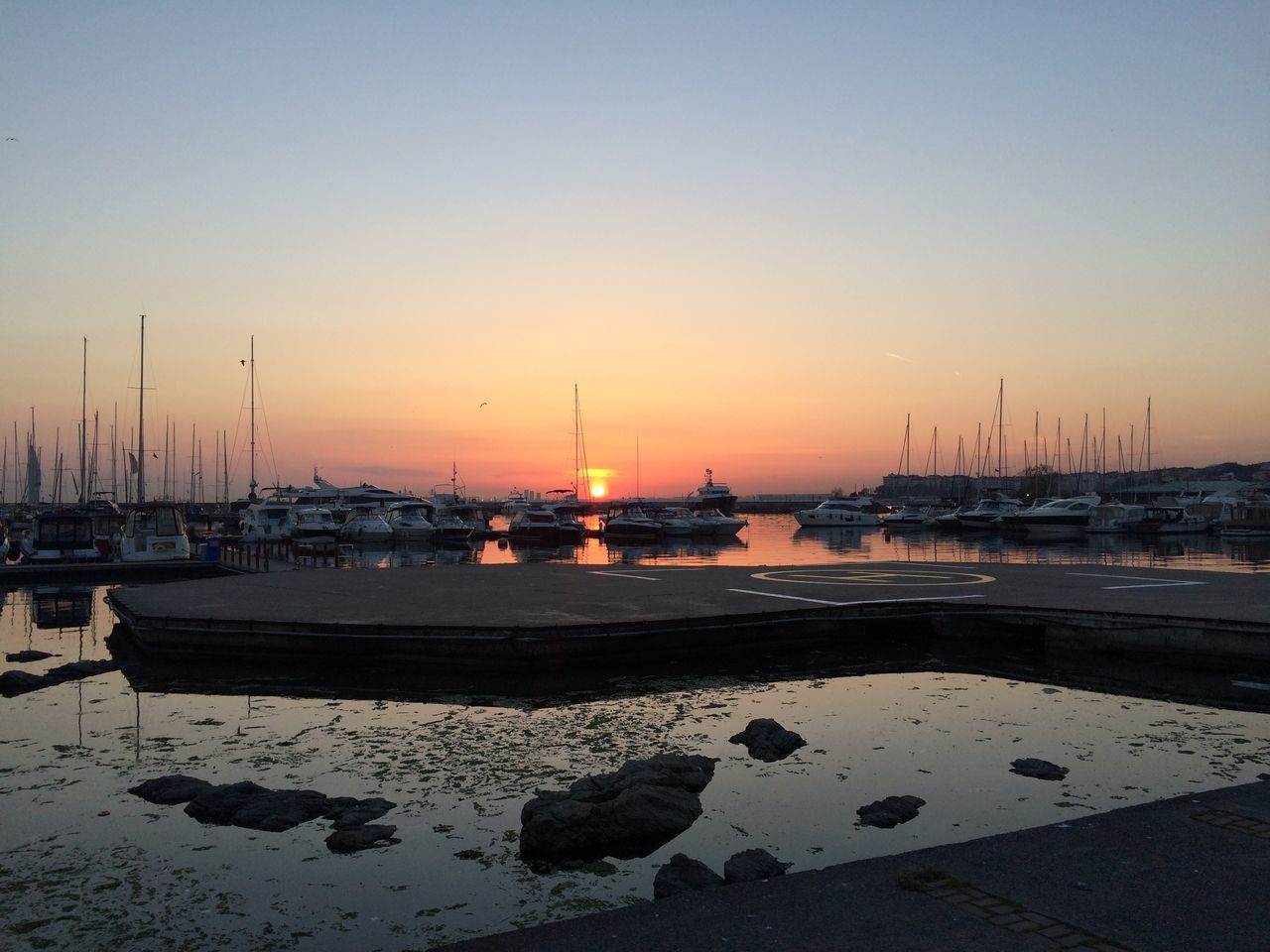 transportation, nautical vessel, mode of transport, boat, moored, water, sunset, sea, clear sky, mast, harbor, copy space, sailboat, tranquil scene, sky, tranquility, nature, beauty in nature, orange color, scenics