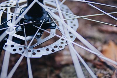 Close-up of bicycle hanging on metal