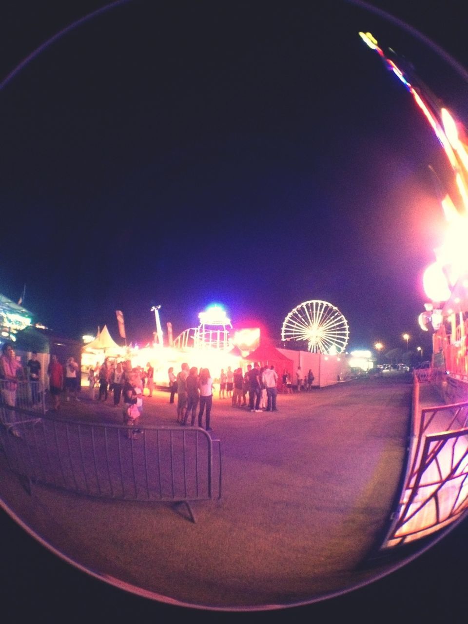 illuminated, night, arts culture and entertainment, leisure activity, amusement park, lifestyles, large group of people, amusement park ride, enjoyment, sky, men, motion, fun, street, lighting equipment, transportation, long exposure, outdoors, light - natural phenomenon