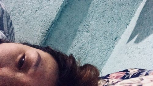 High angle view of woman lying down on street