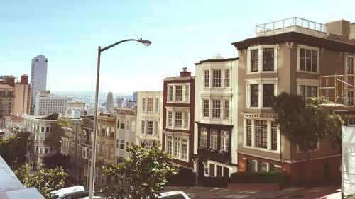 Buildings in city against sky