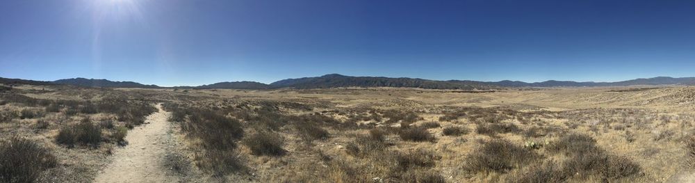 Scenic view of landscape against clear blue sky