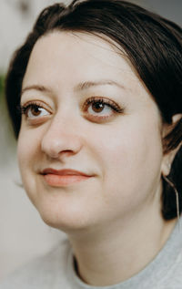 Portrait of a beautiful brunette girl with eyelashes.