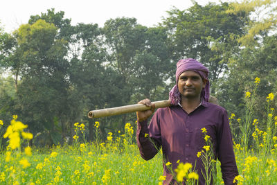 Young man standing on field