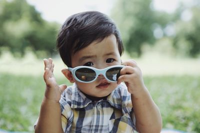 Portrait of happy boy wearing sunglasses