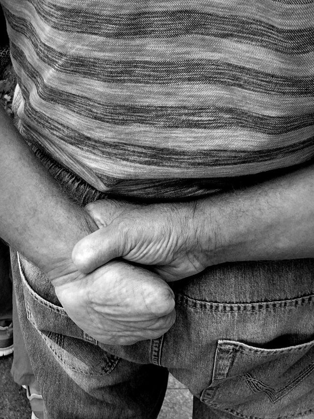 CLOSE-UP OF WOMAN HAND ON THE WALL