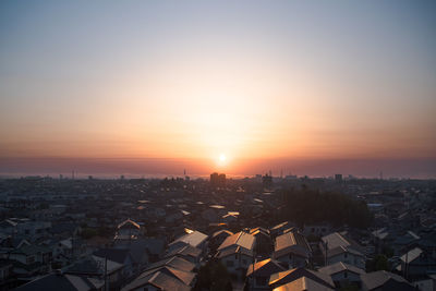 High angle view of townscape against sky during sunset