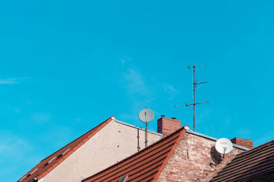 Low angle view of buildings against blue sky