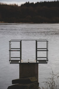 Empty pier on sea against sky