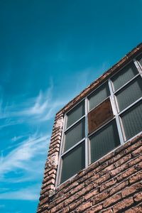 Low angle view of building against clear blue sky