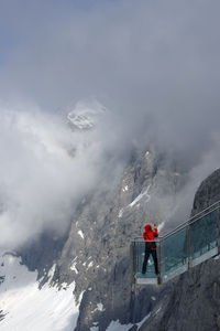 Man skiing on snow covered mountain