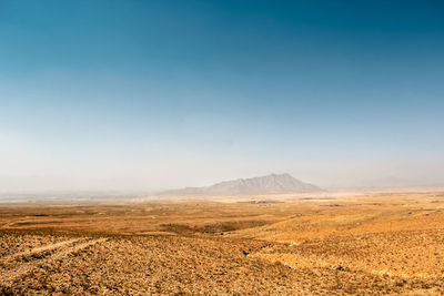 Scenic view of landscape against clear blue sky