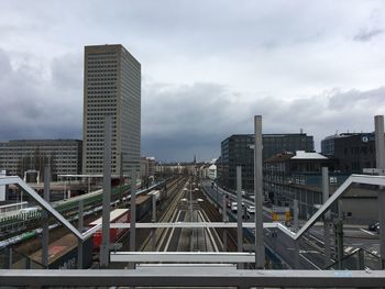 High angle view of railroad tracks against sky in city