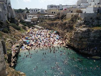 High angle view of people by sea in city