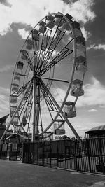 Low angle view of ferris wheel against sky