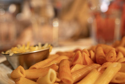 Close up of macaroni with tomato and cheese server on a restaurant