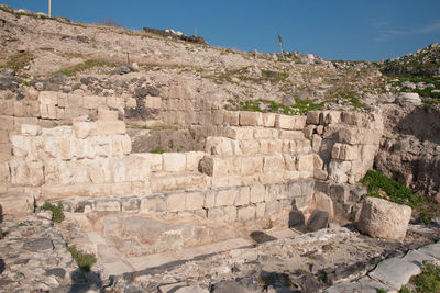 View of stone wall with mountain in background