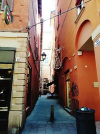 Narrow alley amidst buildings in city