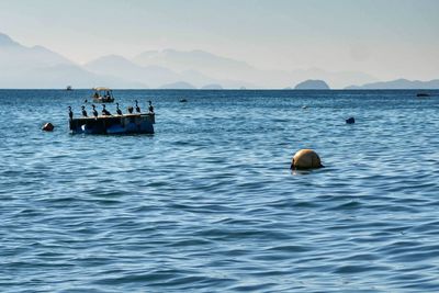 Boat in sea against sky