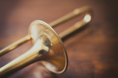 Close-up of trombone on floor