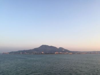 Scenic view of sea against clear sky during sunset