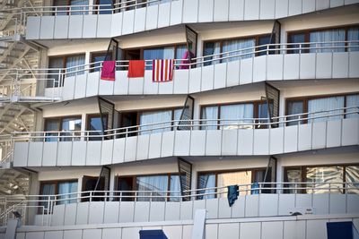 Low angle view of flags hanging on building