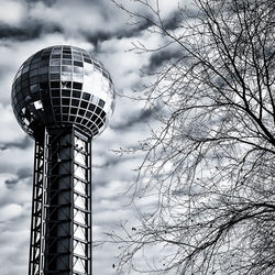 Low angle view of communications tower against sky