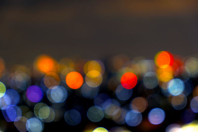 Defocused image of illuminated lights at night