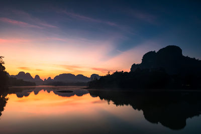 Nong thale swamp and limestone karst mountian view at dawn with sun ray light in krabi, thailand