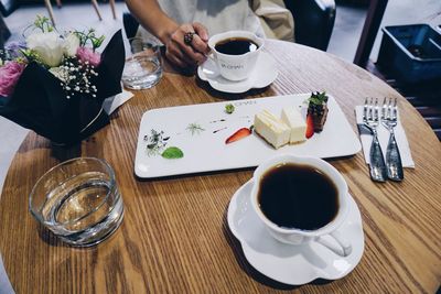 High angle view of coffee served on table