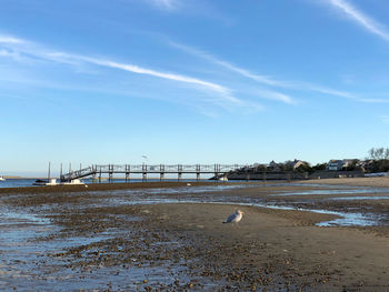 Bridge over sea against sky